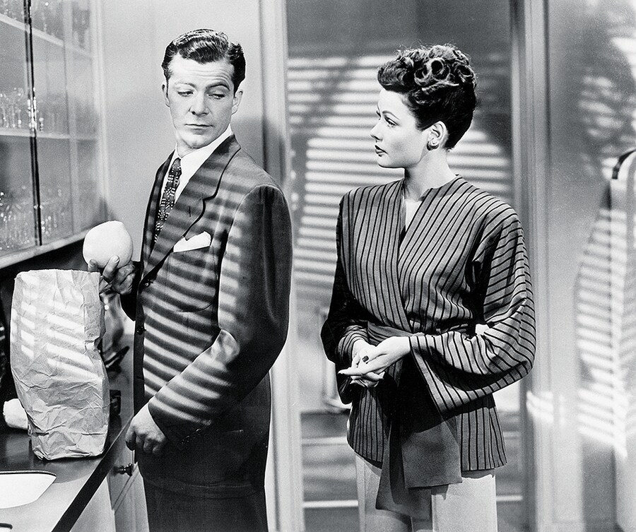 Laura (Gene Tierney), returned from the dead, is given the t