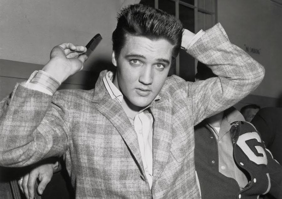 Elvis Presley combing his hair