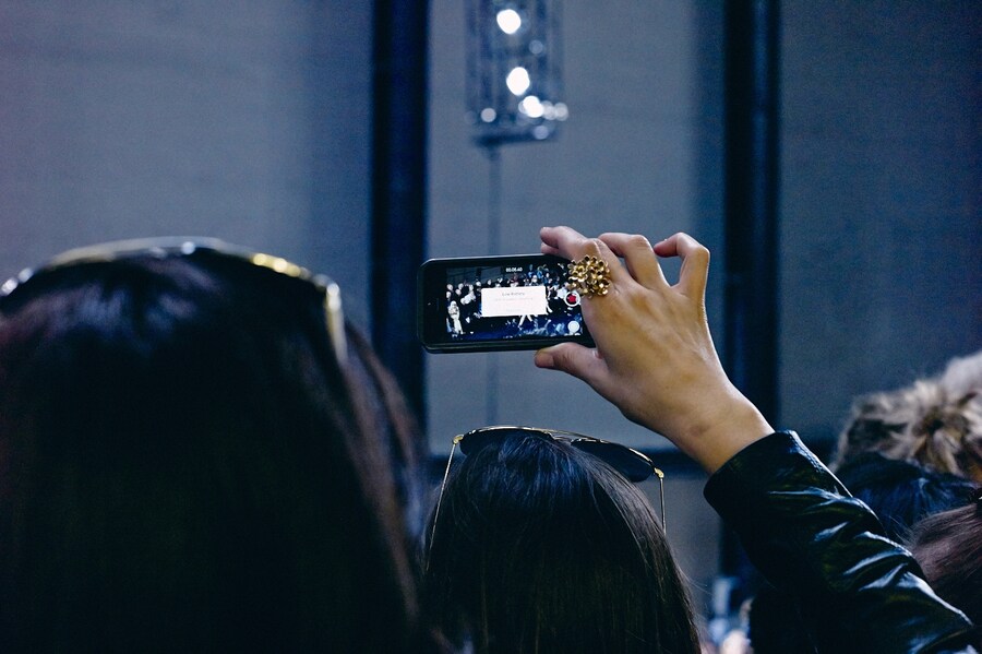 On the Phone at London Fashion Week S/S15