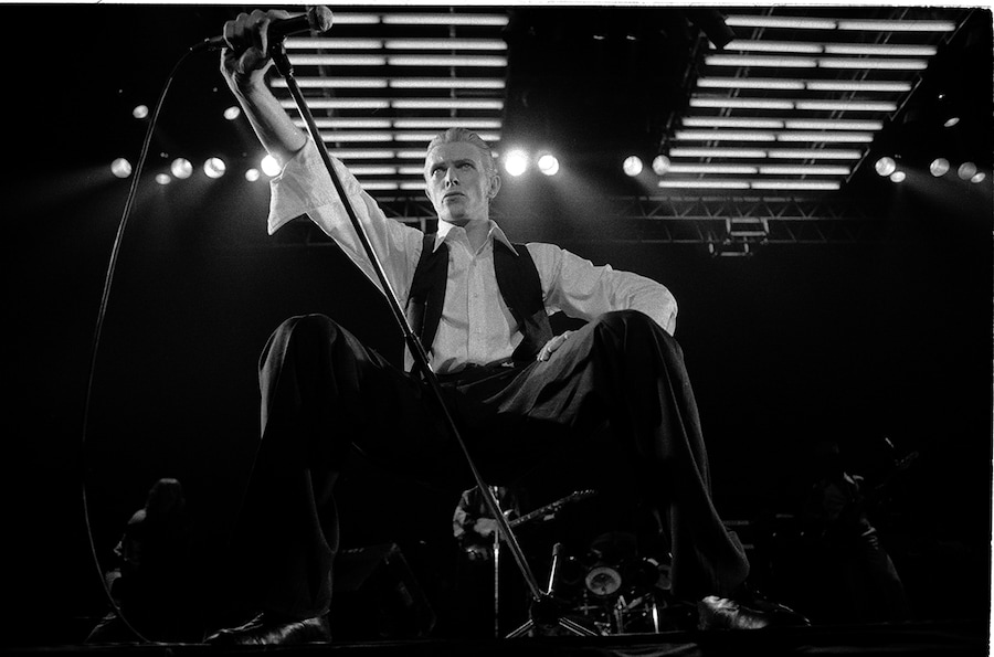 Singer David Bowie performing on stage as the Thin White Duk