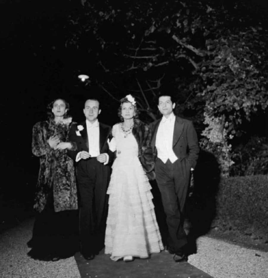 Coco Chanel, Serge Lifararrive and Paul Morand arrive at the