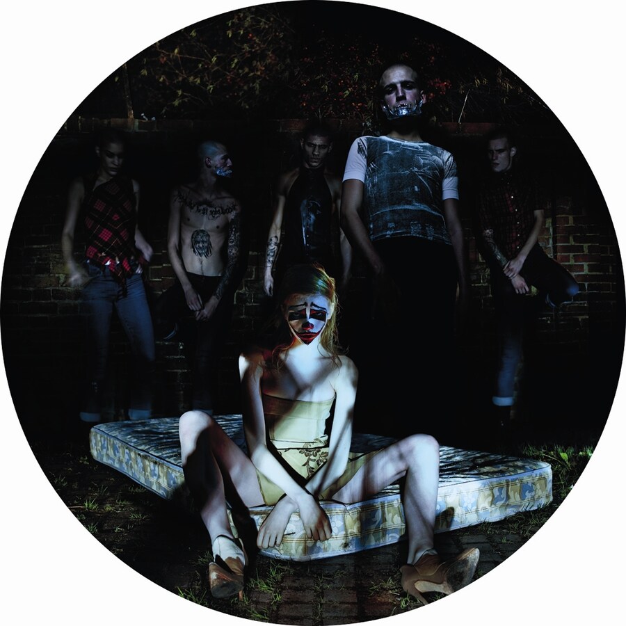 Stella wears leather corset dress and cowhide leather shoes 