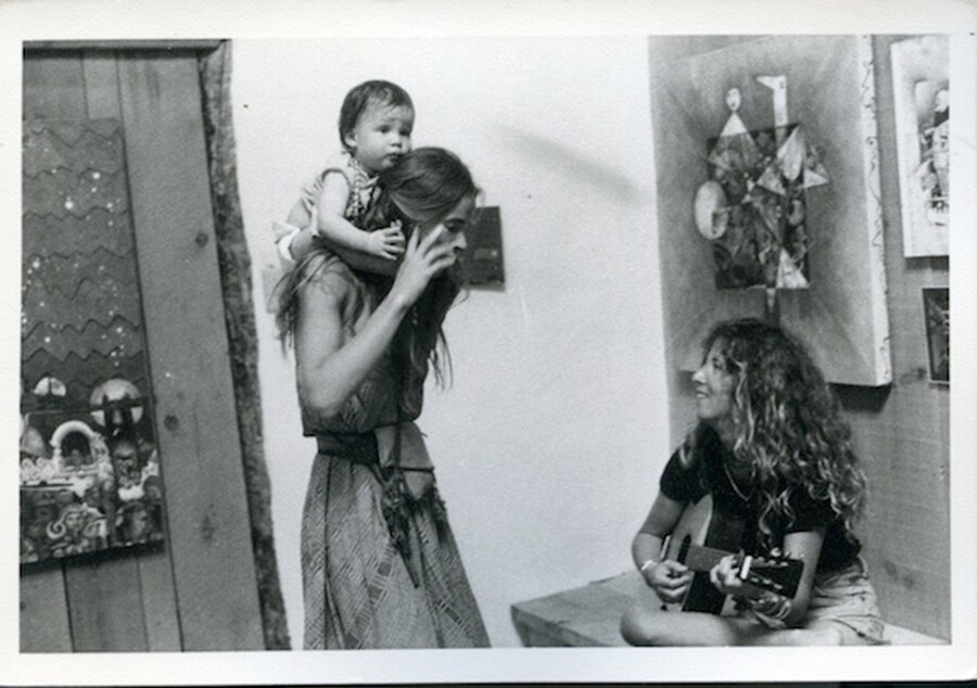 Untitled (woman with baby on shoulders)