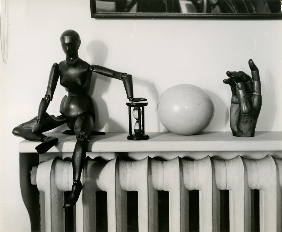 Andre Kertesz, Mantlepiece with wooden figure, woo