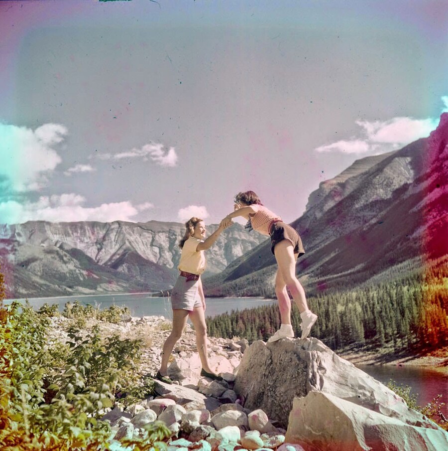 Women clambering over rocks near Morraine Lake, 1951