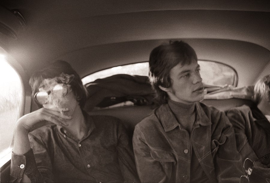 Keith and Mick in the backseat of a limousine in London in 1