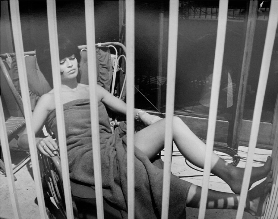 Tazio-Secchiaroli,-Behind-Bars-(Bardot-on-the-set-