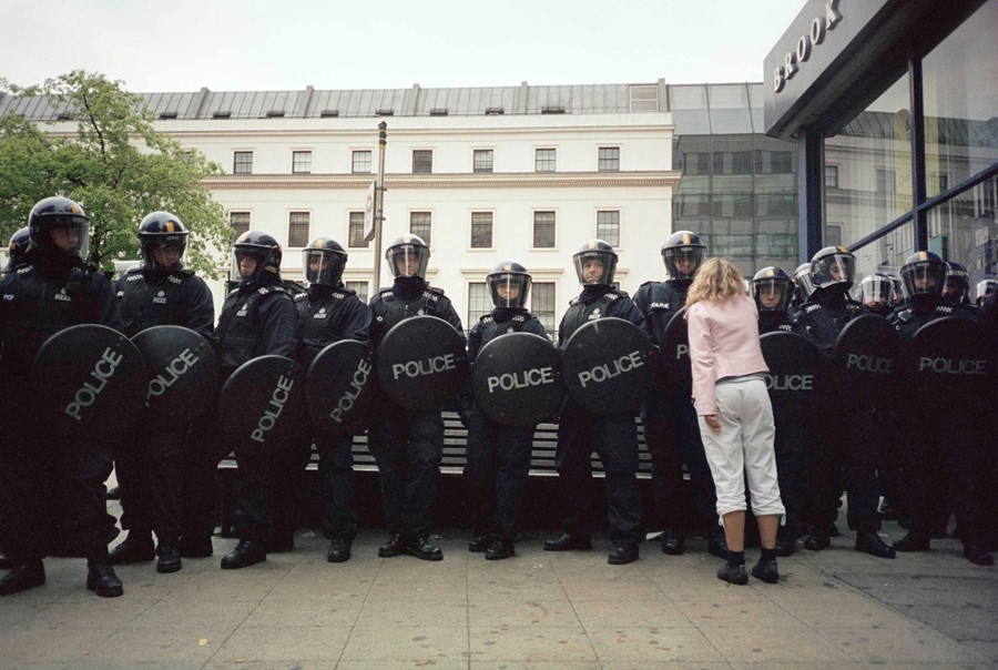 Pink Girl and Riot Cops - Vinca Petersen