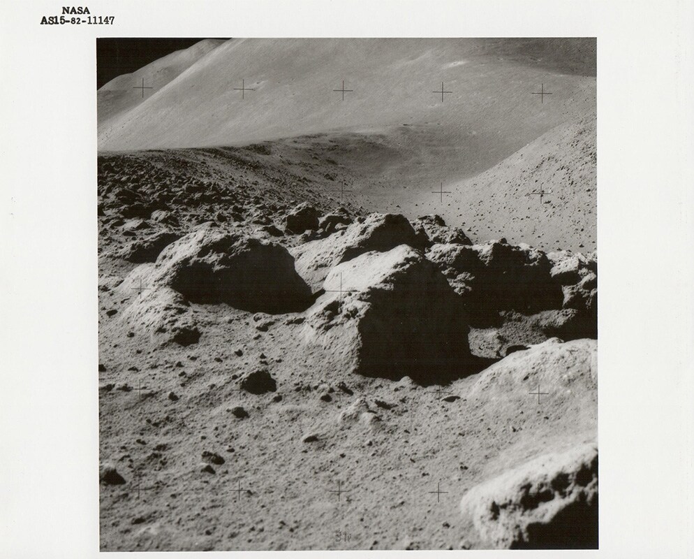 Lunar boulders, St. George Crater beyond, Apollo 15, July 19